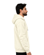 Side view of an off-white pullover hoodie with ribbed cuffs and hem