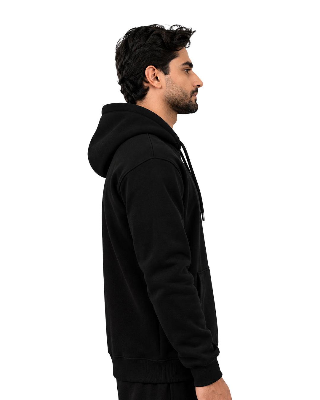 Side view of a black pullover hoodie with ribbed cuffs and hem